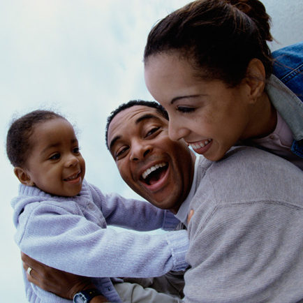 Father and mother together with their daughter at